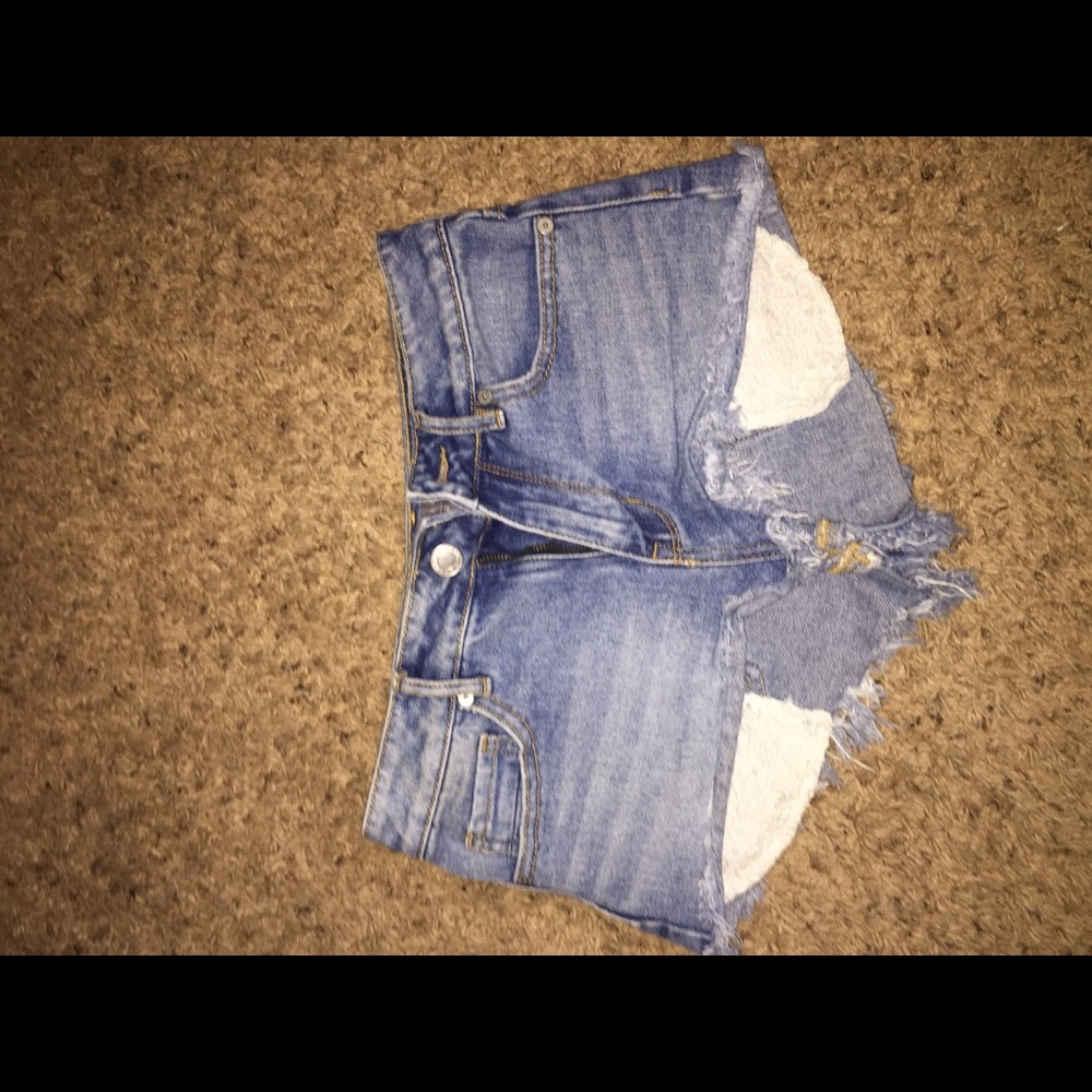 High waisted distressed cut off jeans